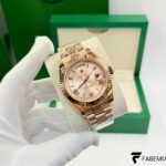 Rolex Day‑Date 40 – 18K Everose Gold – Sundust Sunburst Roman Dial – Fluted Bezel – President Bracelet – Ref. 228235