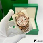 Rolex Day‑Date 40 – 18K Everose Gold – Sundust Sunburst Roman Dial – Fluted Bezel – President Bracelet – Ref. 228235